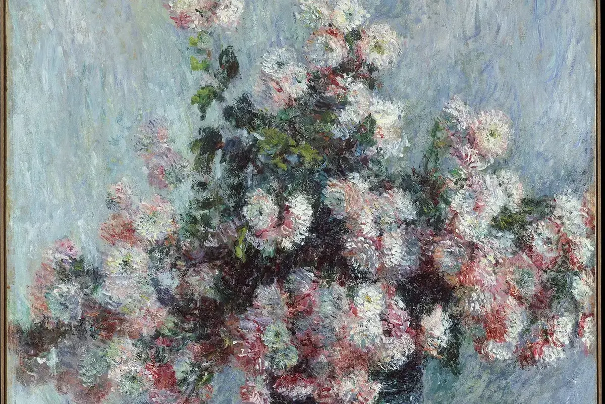 Small flower vase placed safely beside a television on a clear surface